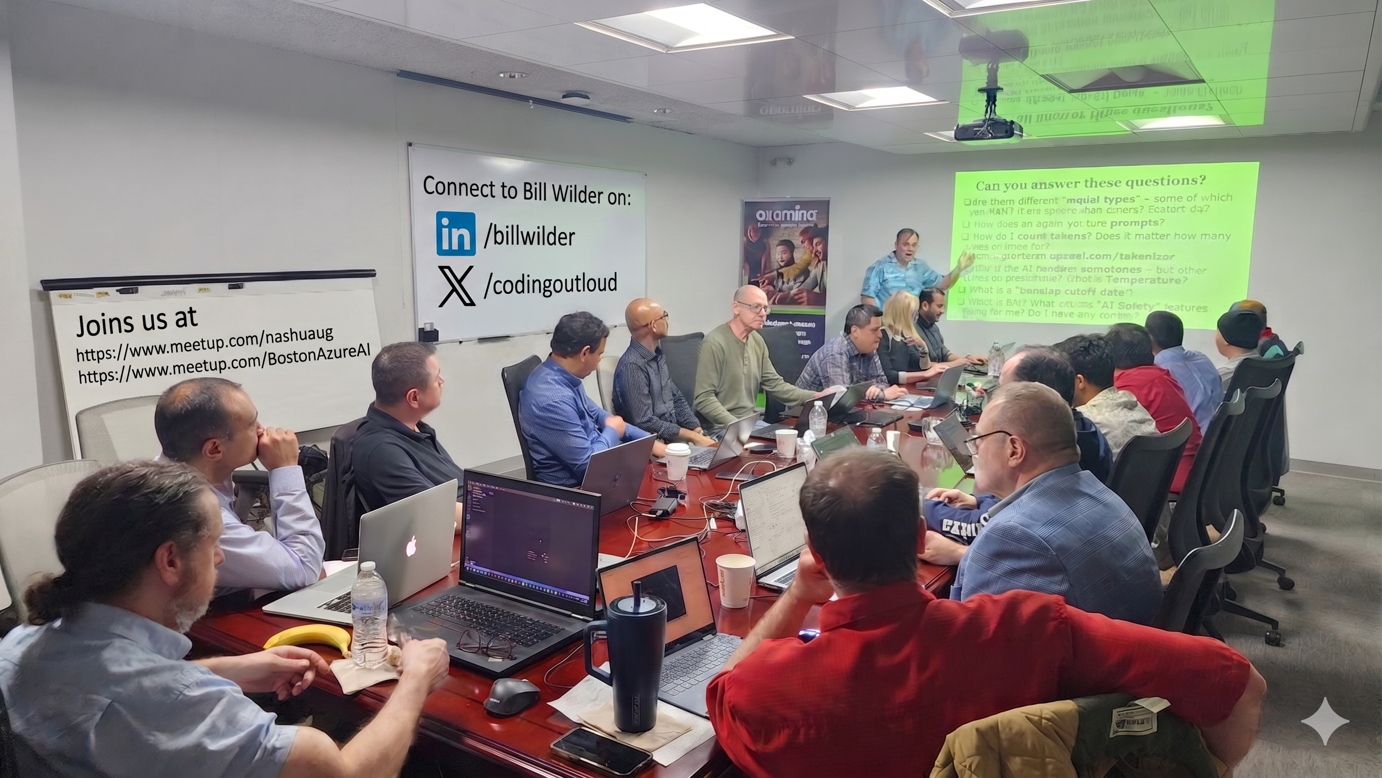 Bill Wilder standing and presenting agent fundamentals to a full room of attendees at the Akumina conference table