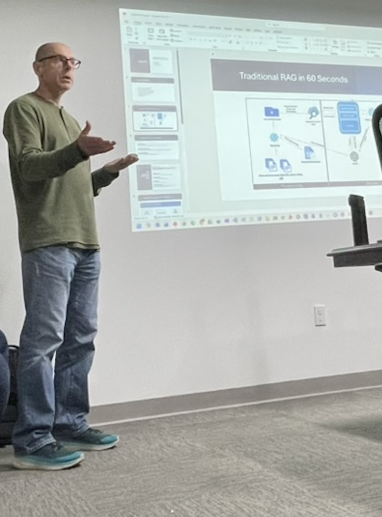 Closer view of Jason Haley explaining agentic RAG beside the projected slides