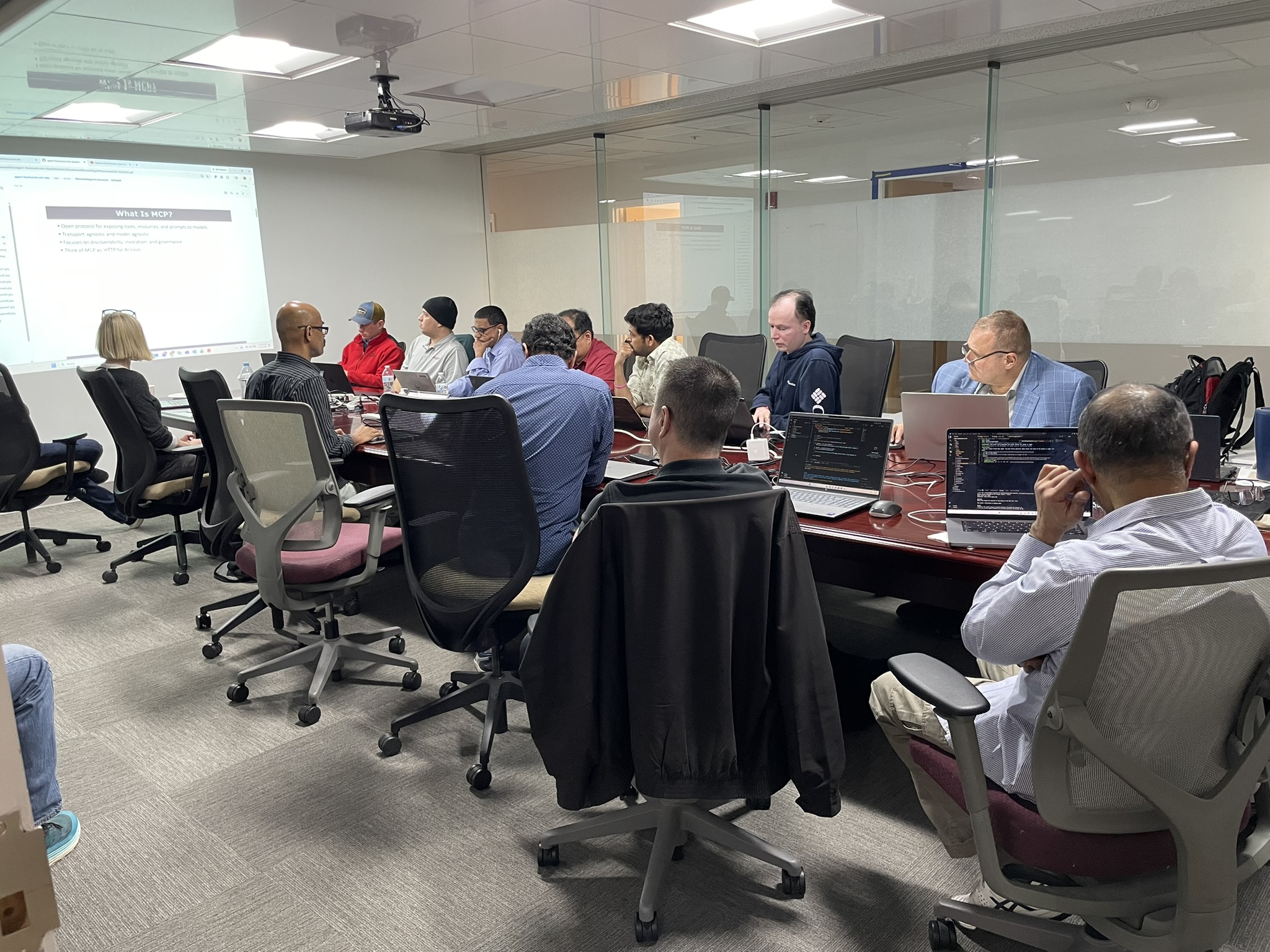 Attendees gathered around the conference table during the What is MCP portion of the workshop